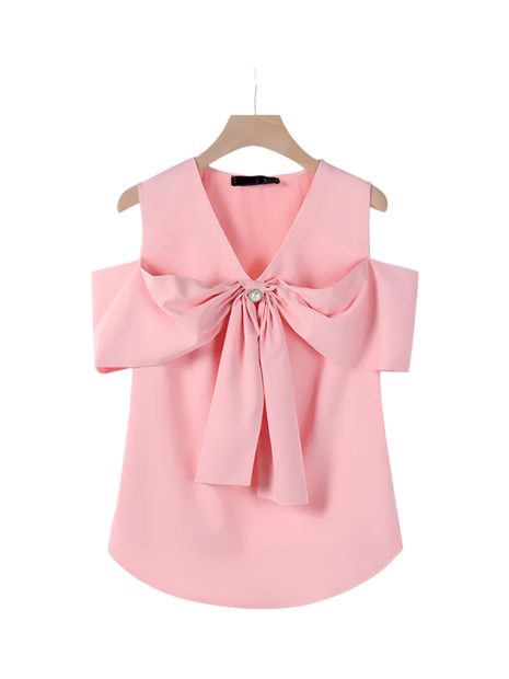 Pink blouse with a large bow on a hanger against a white background