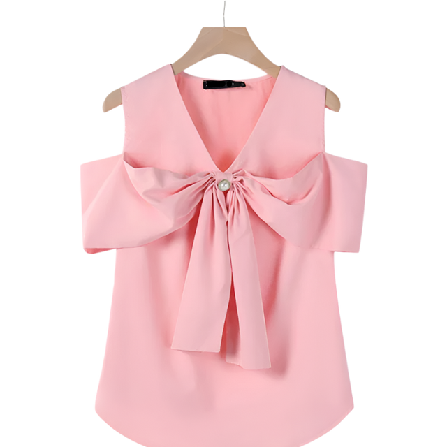 Pink blouse with a large bow on a hanger against a white background