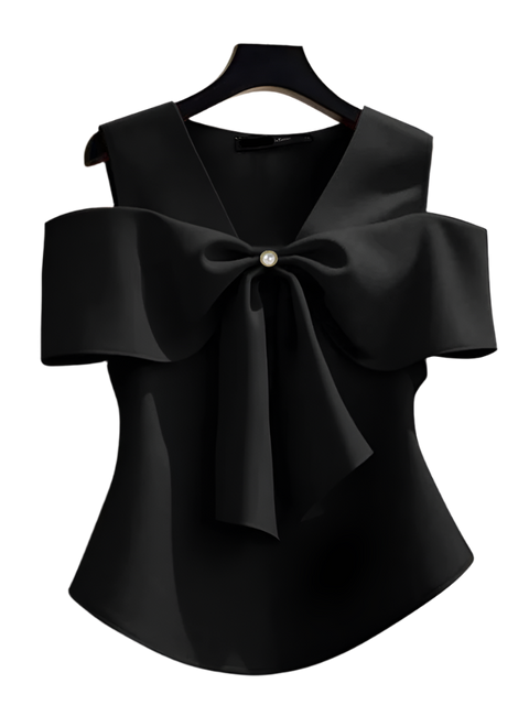 Black blouse with a large bow on a hanger against a neutral background