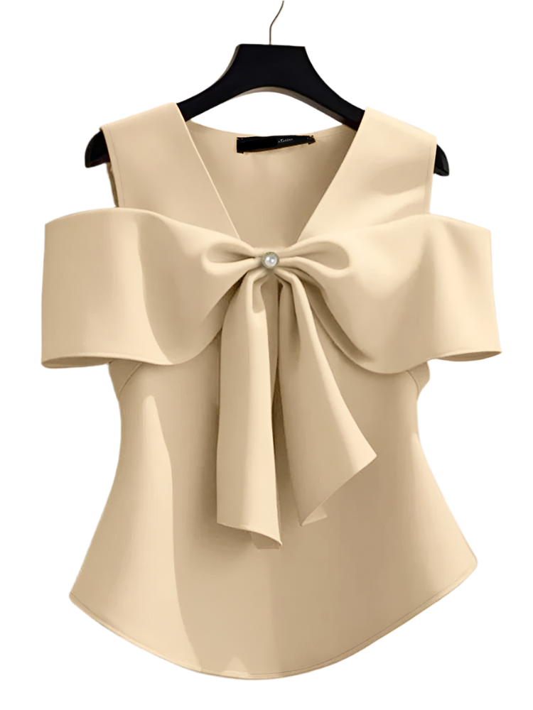 Beige blouse with a large bow detail on a hanger against a neutral background