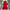 Red dress with floral details on a gray surface with decorative elements