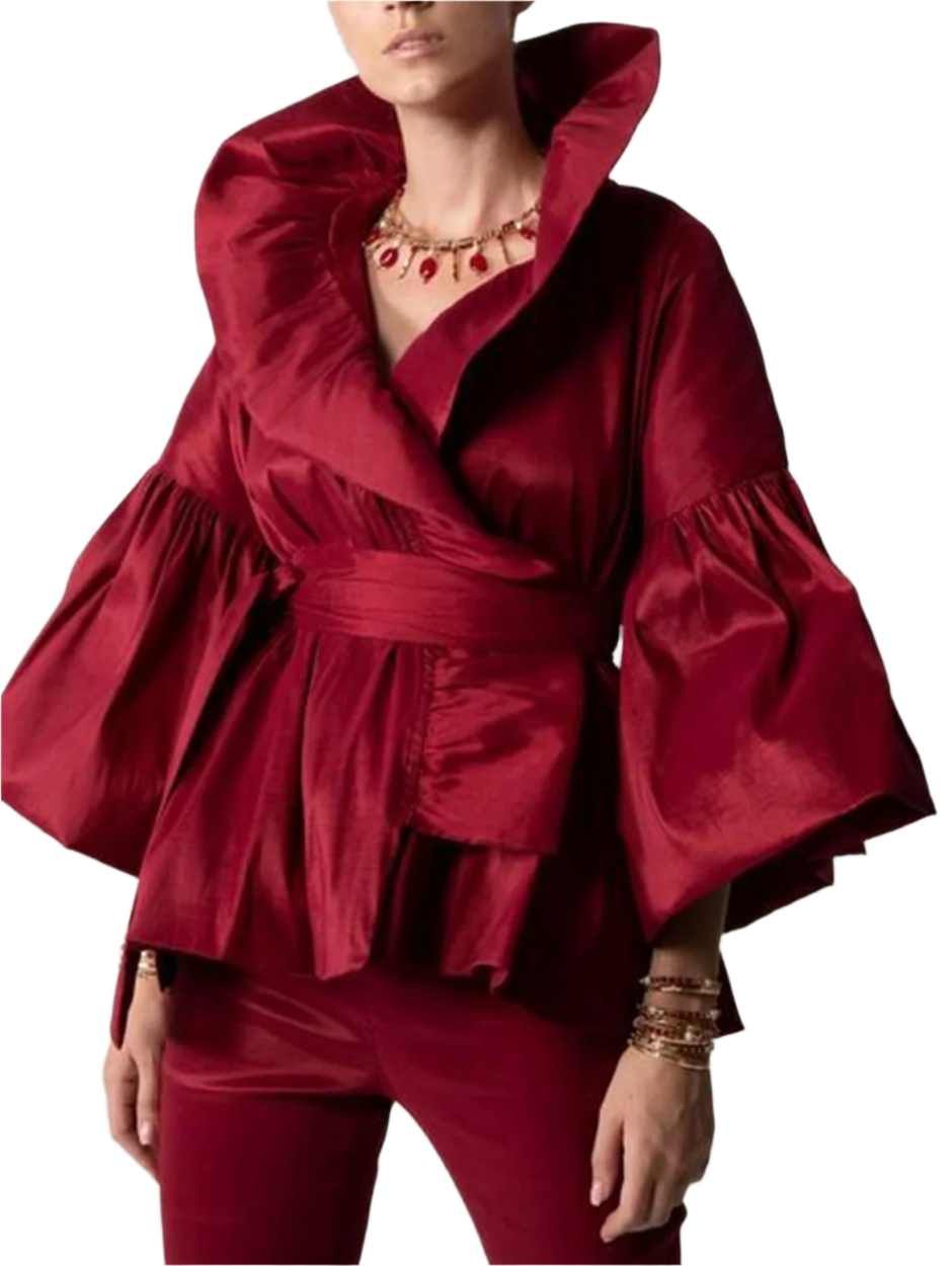 Red outfit with ruffled sleeves on a plain background