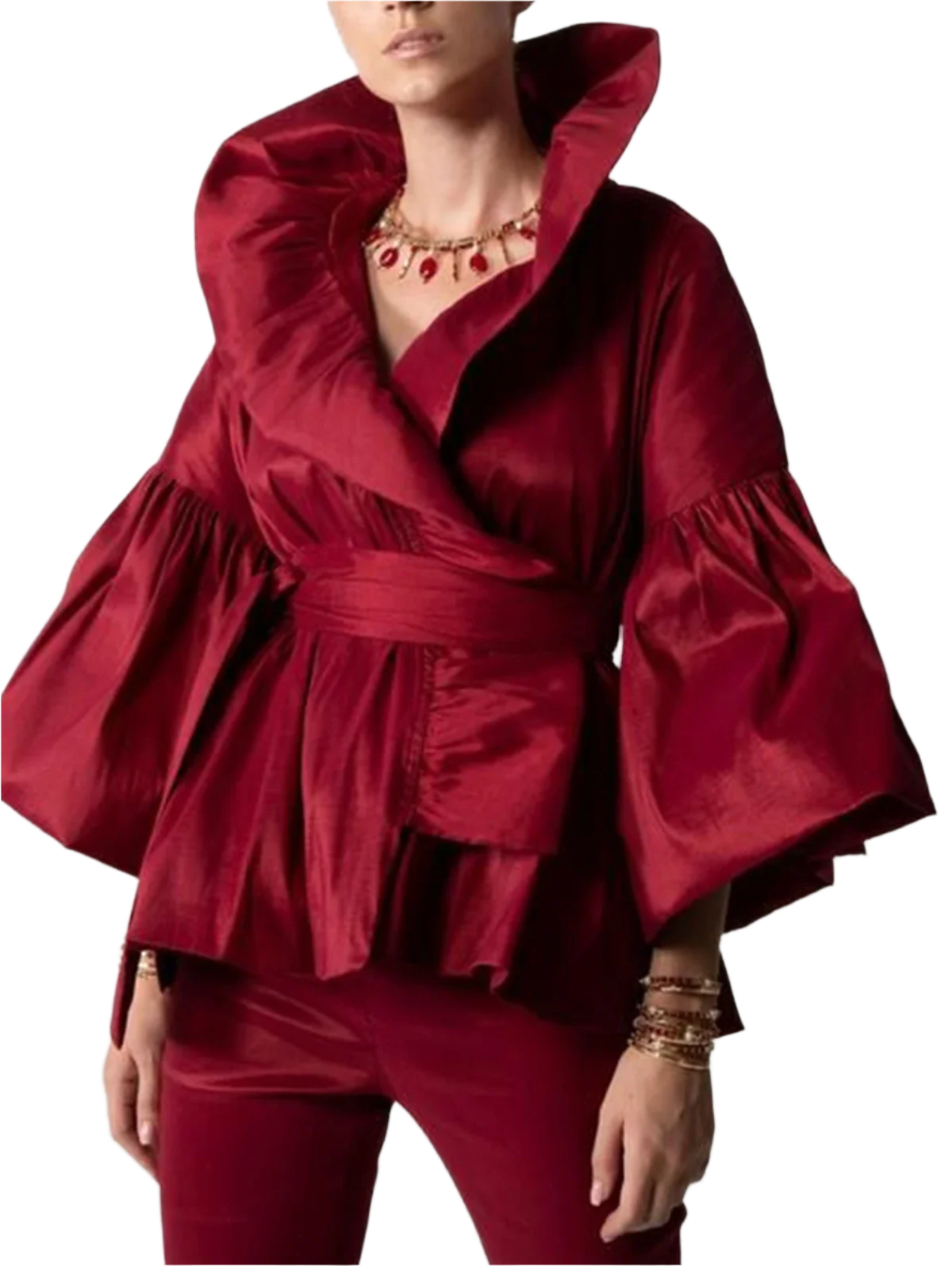 Red outfit with ruffled sleeves on a plain background