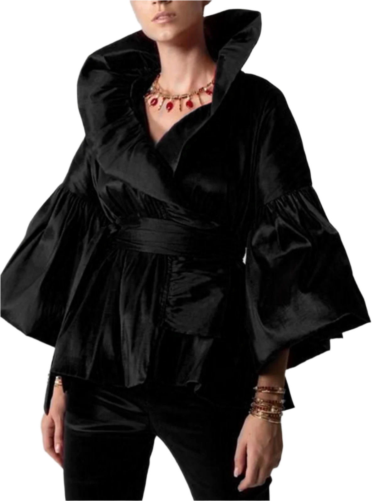 Black ruffled top worn by a person on a plain background