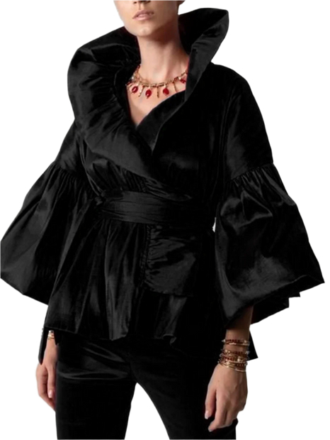Black ruffled top worn by a person on a plain background