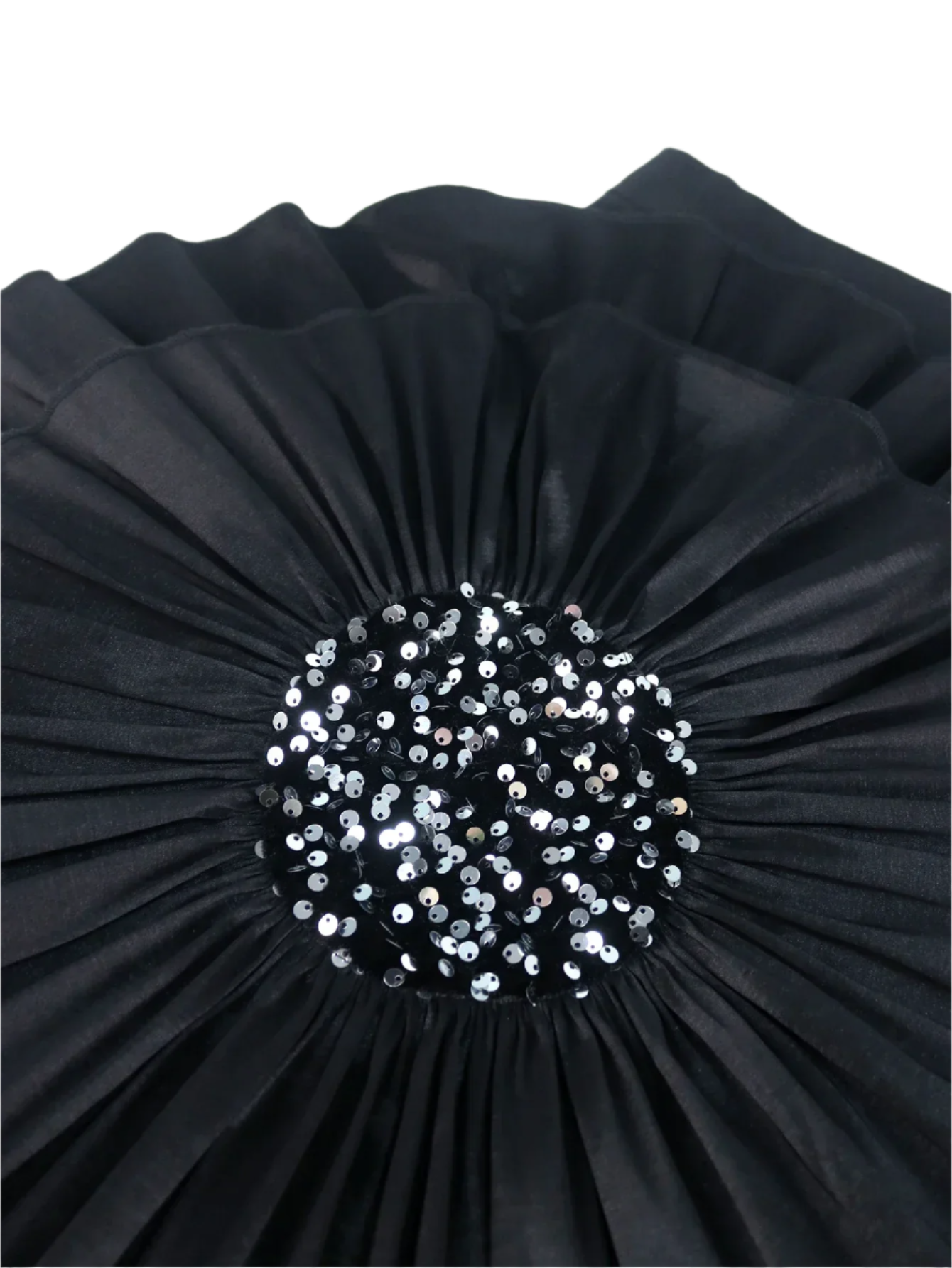 Black pleated clutch with a central sequin embellishment on a white background