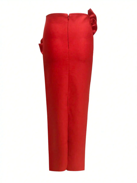 Red pants with a decorative bow on a white background