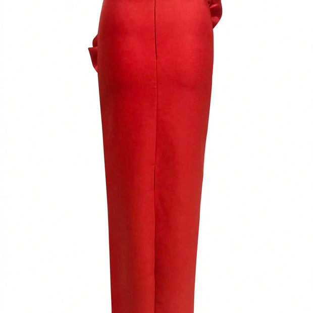 Red pants with a decorative bow on a white background