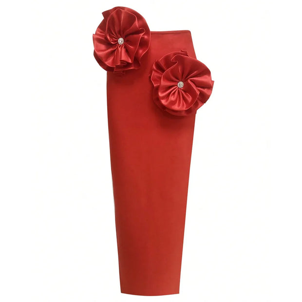 Red skirt with floral embellishments on a white background