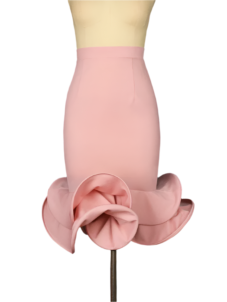 Pink skirt with ruffled bottom on a mannequin against a dark background