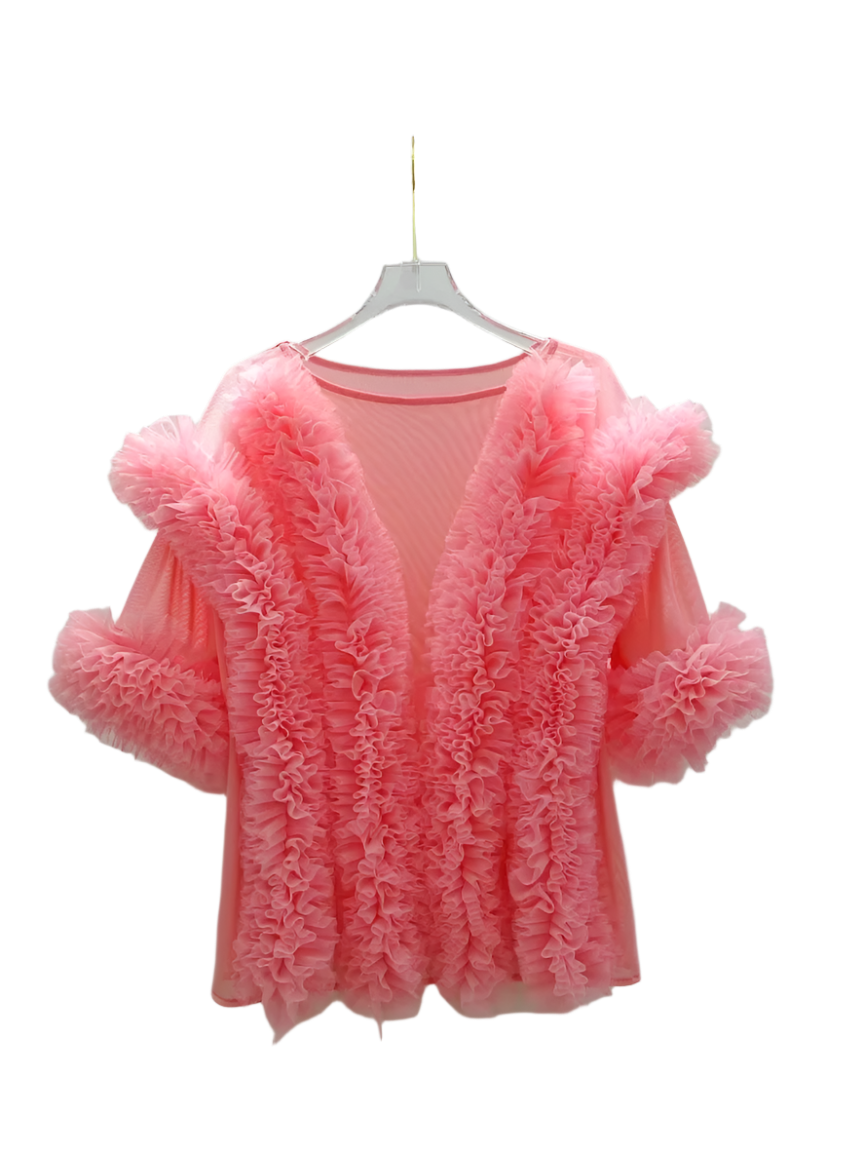 Pink textured cardigan on a hanger against a white background