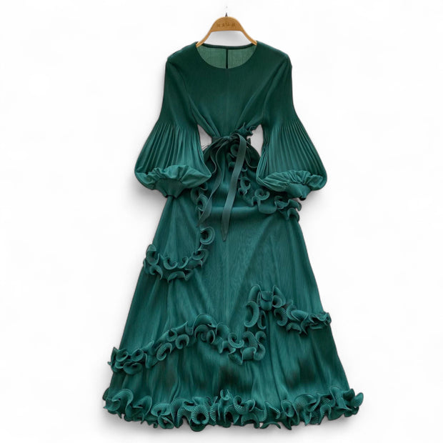 Green dress with ruffled details on a white background