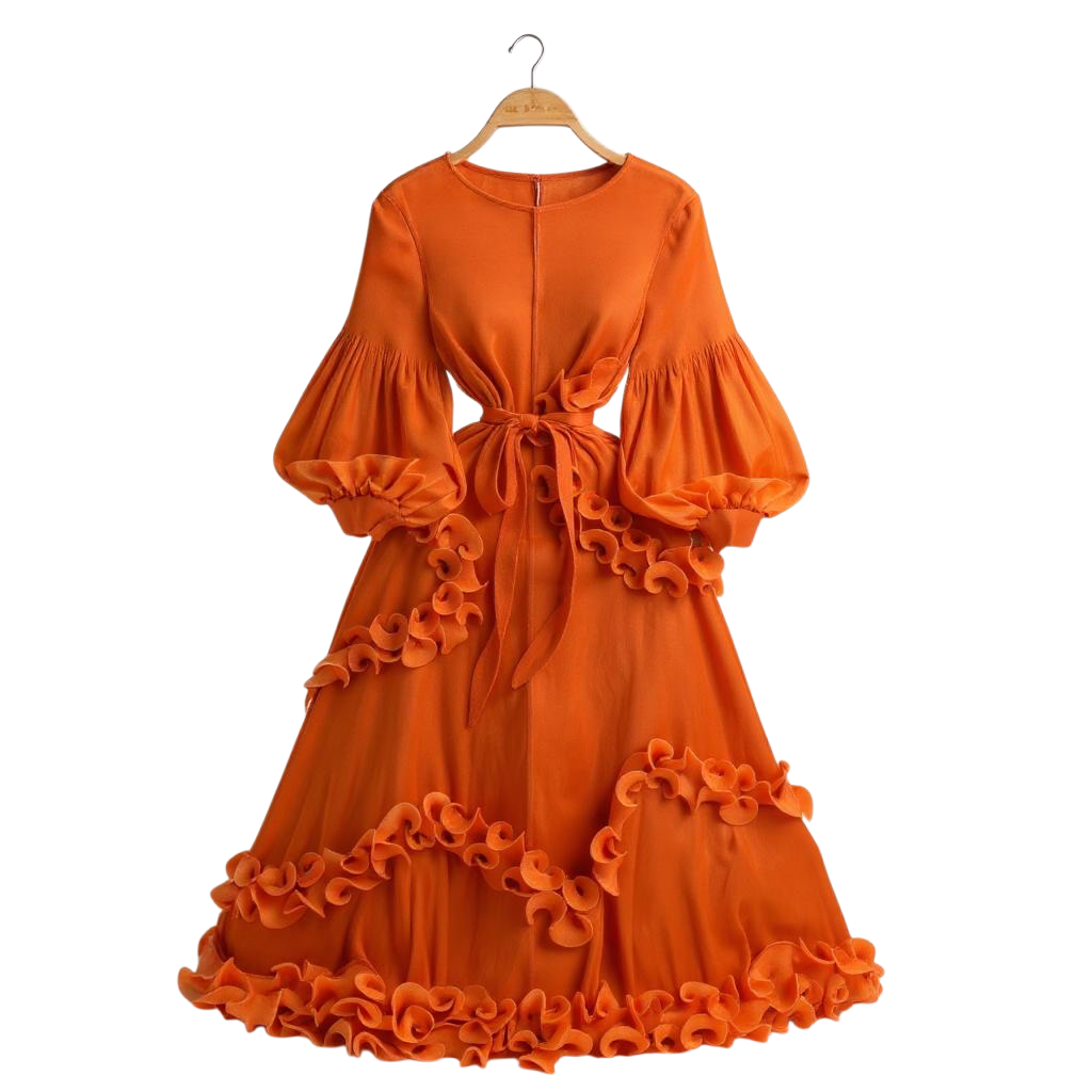 Orange dress with ruffled details on a hanger against a white background