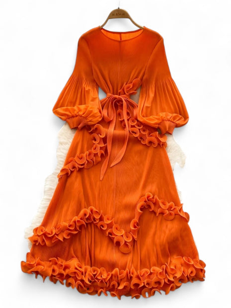 Orange dress with ruffled layers on a white background