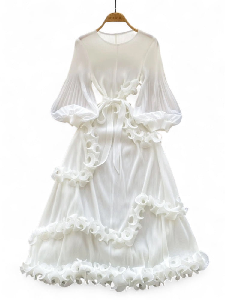 White dress with ruffled details on a white background