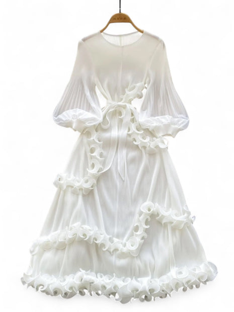 White dress with ruffled details on a white background