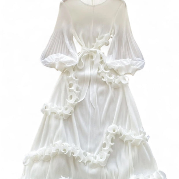 White dress with ruffled details on a white background