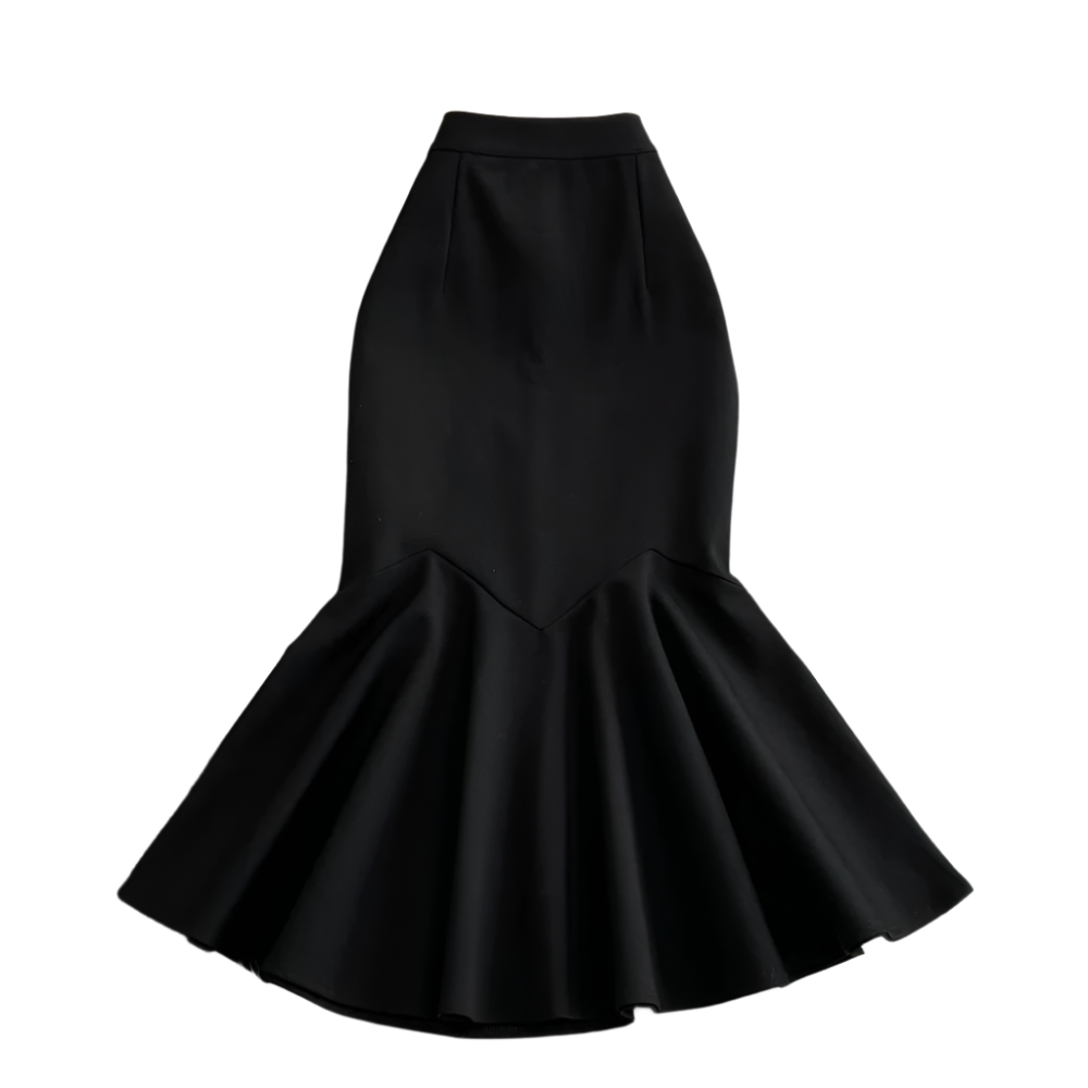 Black mermaid-style skirt on a textured surface with flowers.