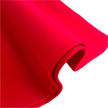 Close-up of red fabric on a textured surface