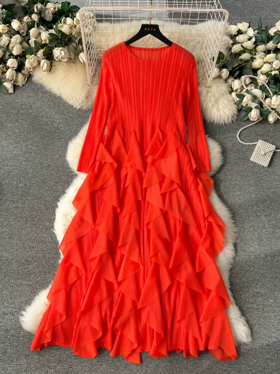 Red ruffled dress on a hanger with decorative background