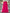 Fuchsia ruffled dress on a hanger with decorative flowers in the background