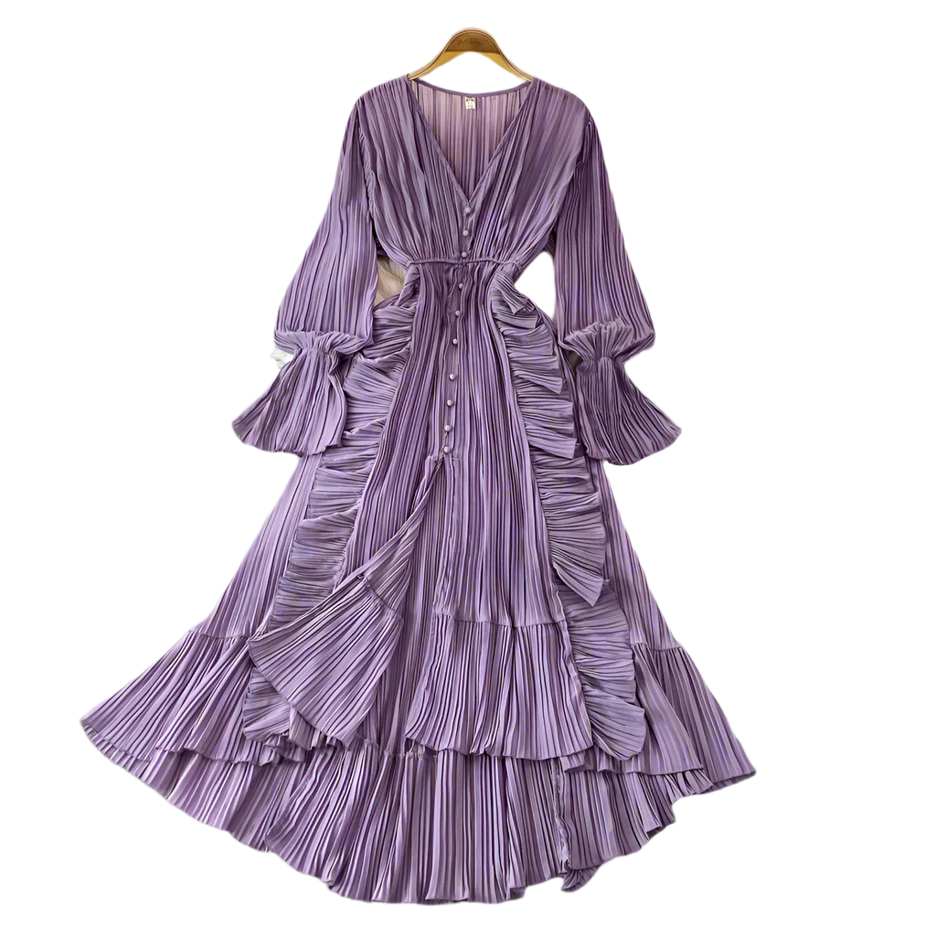 Purple pleated dress on a hanger against a gray background